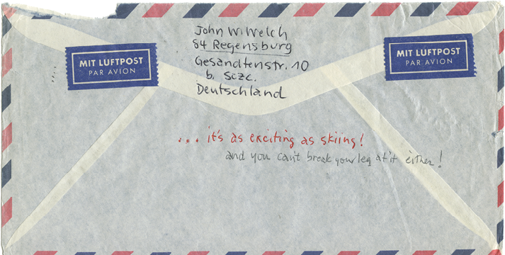 Photograph of the back of an airmail envelope showing the return address and handwritten notes in ink.