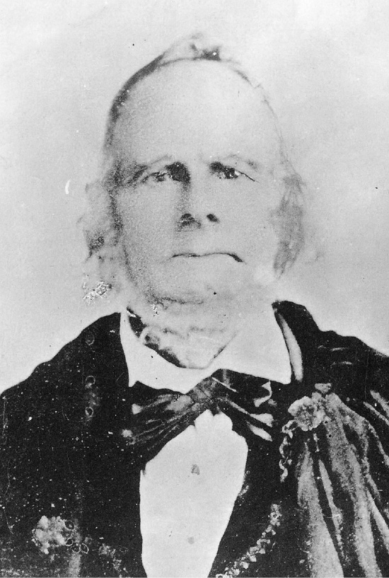Portrait of Zera Pulsipher, elderly man seated, wearing dark coat