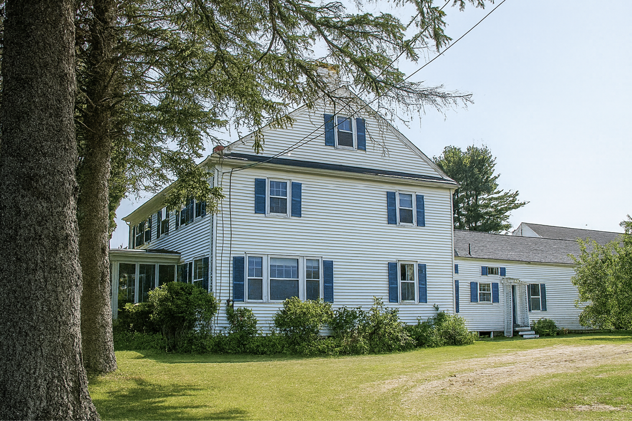 Ezra and Sarah Carter home in Maine, white house with fenced yard